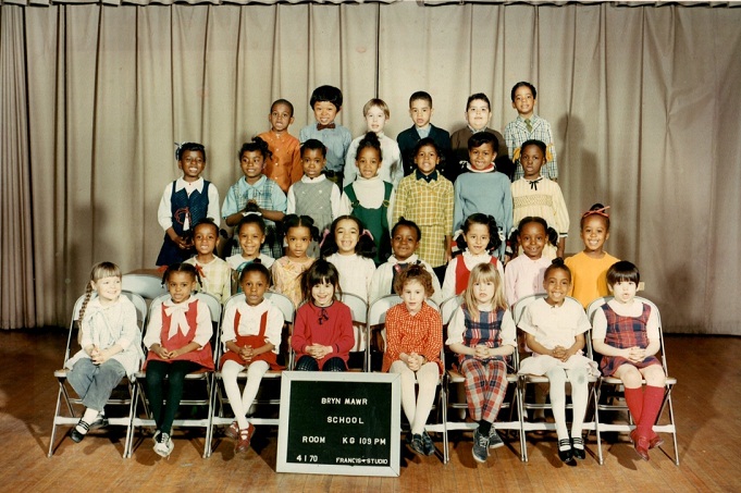 Michelle Obama’s kindergarten class picture. Michelle Obama stands on the third row (second from the right) and her first kiss, Dr. Theodore Ford, stands on the back row (second from the left).