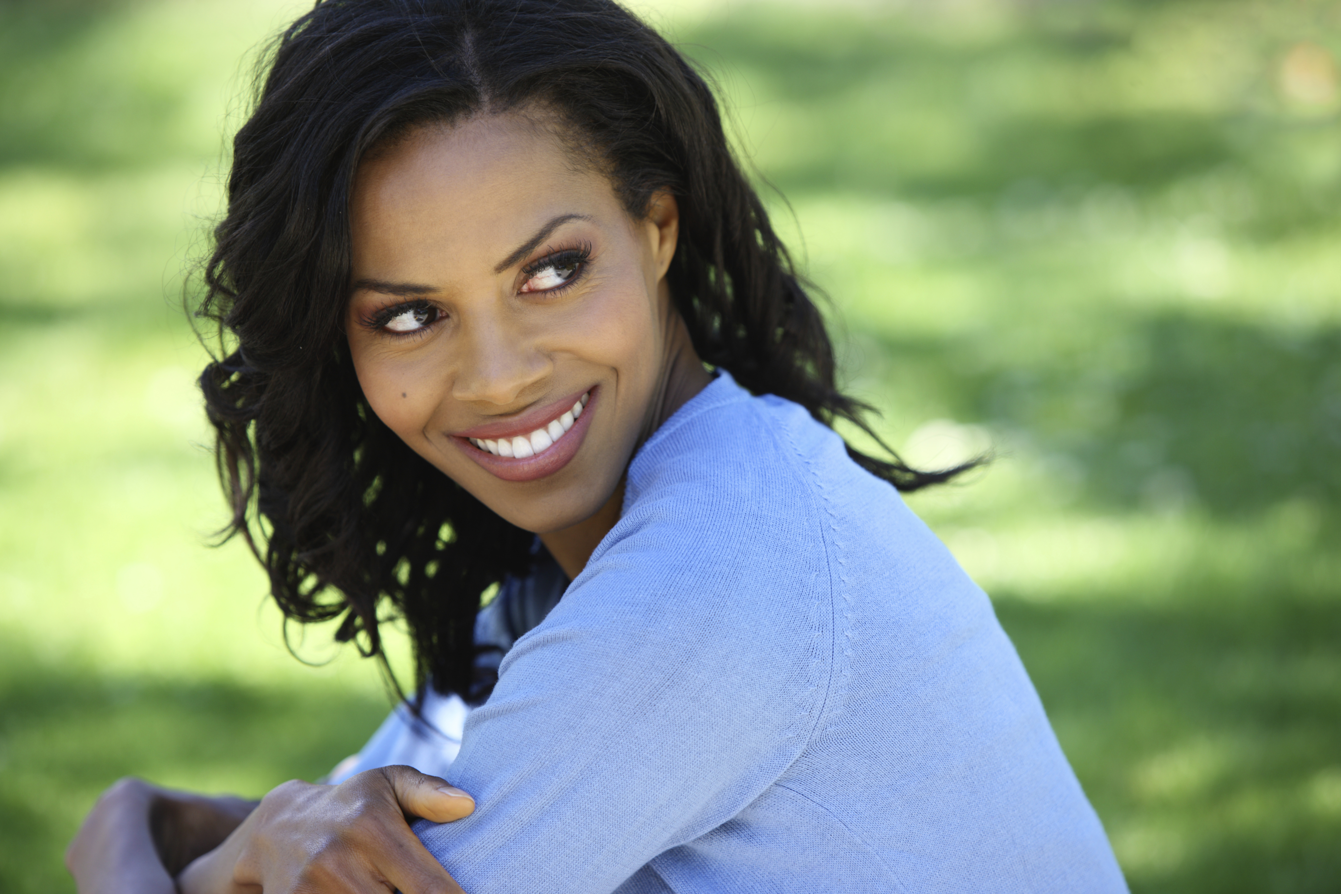 A beautiful woman smiling in a park
