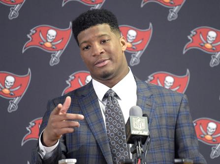 FILE - In this Dec. 27, 2015, file photo, Tampa Bay Buccaneers quarterback Jameis Winston (3) answers a question from a reporter during a post-game news conference after an NFL football game against the Chicago Bears,  in Tampa, Fla. Florida State University said Monday, Jan. 25, 2016, it's settling a lawsuit with a former student who said she was raped by former star quarterback Jameis Winston.  (AP Photo/Phelan M. Ebenhack, File)