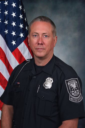This undated photo provided by the DeKalb County Police Department shows officer Robert Olsen. Olsen fatally shot Anthony Hill, 27, on Monday, March 9, 2015, while responding to reports of a suspicious person knocking on doors and crawling on the ground naked at an apartment complex just outside Atlanta. Police officers facing indictment in Georgia have a privilege that the average citizen doesnt have and that even police dont have in other states. Georgia law requires that a law enforcement officer be notified in advance that a grand jury will hear his or her case. The officer is also allowed to sit in on the entire proceeding and make a statement at the end that prosecutors cant question. (AP Photo/DeKalb County Police Department)