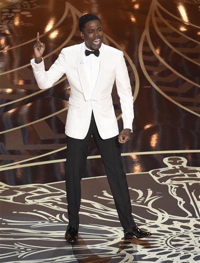 FILE - In this Feb. 28, 2016 file photo, host Chris Rock speaks at the Oscars at the Dolby Theatre in Los Angeles. The Nielsen company said Tuesday that an estimated 3.22 million black viewers watched the Oscars on ABC Sunday, a decline of 2 percent from the 2015 show. The show's overall viewership of 34.4 million was an eight-year low, and a drop of nearly 8 percent from the year before. (Photo by Chris Pizzello/Invision/AP, File)