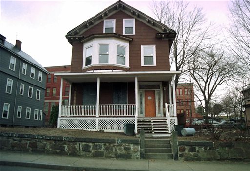 FILE - This March 10, 1998, file photo shows the house where slain African-American leader Malcolm X spent part of his childhood, in the Roxbury section of Boston. Archeologists in Boston are digging at the boyhood home of black rights activist Malcolm X. The two-week archaeological dig begins Tuesday, March 29, 2016. (AP Photo/Angela Rowlings, File)