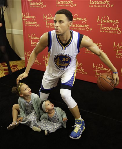 Riley Curry left, and her sister Ryan, look up at a wax figure of their father, Golden State Warriors guard Stephen Curry, after its unveiling by Madame Tussauds Thursday, March 24, 2016, in Oakland, Calif. The figure of the NBA MVP will go on display at Madame Tussauds wax museum at Fisherman's Wharf in San Francisco. (AP Photo/Eric Risberg)