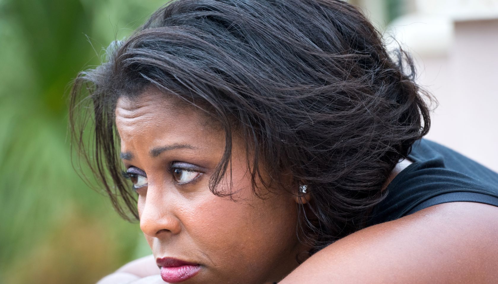 Pensive woman looking away