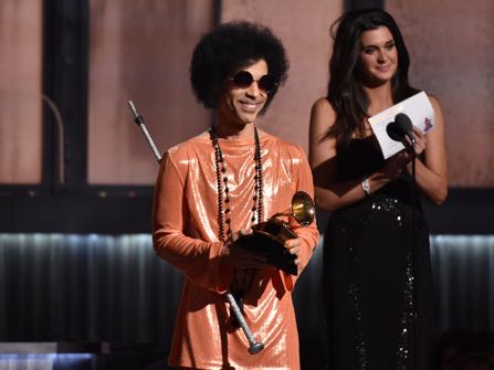 FILE - In this Feb. 8, 2015, file photo, Prince presents the award for album of the year at the 57th annual Grammy Awards in Los Angeles. Beyond dance parties and hit songs, Prince’s legacy included black activism. He said black lives matter before presenting a 2015 Grammy. (Photo by John Shearer/Invision/AP, File)