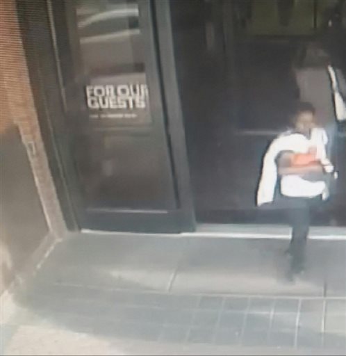 This image made from a surveillance video provided by the Upper Merion Township Police Department shows a woman leaving the King of Prussia Mall with 7-week-old Ahsir Simmons on Thursday, March 31, 2016, in Philadelphia. Police are searching for a woman who they say kidnapped the baby boy from the upscale shopping mall in suburban Philadelphia. (Upper Merion Township Police Department via AP)