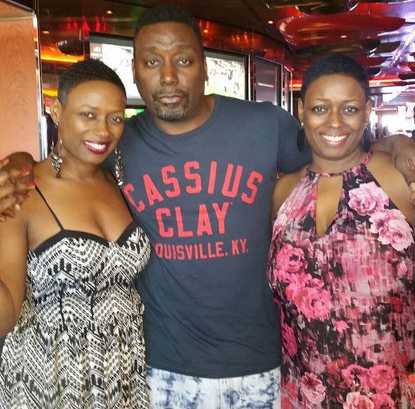 Big Daddy Kane snaps a photo with cruisers.