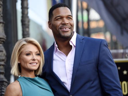 FILE - In this Oct. 12, 2015 file photo, Kelly Ripa, left, poses with Michael Strahan, her co-host on the daily television talk show "LIVE! with Kelly and Michael," during a ceremony honoring Ripa with a star on the Hollywood Walk of Fame in Los Angeles. Ripa returns as co-host of the morning show after a four-day absence after ABC announced Tuesday that co-host Strahan will leave the show to join "Good Morning America" full-time.   (Photo by Chris Pizzello/Invision/AP, File)