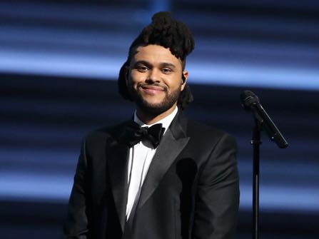 FILE - In this Feb. 15, 2016 file photo, The Weeknd appears at the 58th annual Grammy Awards in Los Angeles. The Weeknd was nominated for 16 Billboard Music Awards, on Monday, April 11, in such categories as top artist top Hot 100 song. The show will air live on ABC from the T-Mobile Arena in Las Vegas on May 22. (Photo by Matt Sayles/Invision/AP, File)
