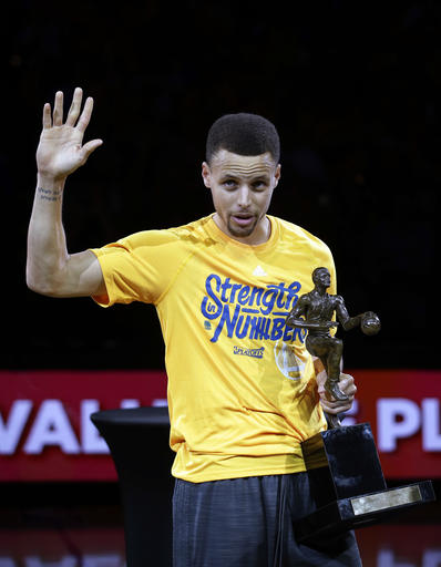 Golden State Warriors' Stephen Curry waves to the crowd after receiving the NBA Most Valuable Player award before Game 5 of the team's second-round NBA basketball playoff series against the Portland Trail Blazers on Wednesday, May 11, 2016, in Oakland, Calif. (AP Photo/Marcio Jose Sanchez)