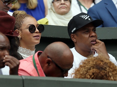 Singer Beyonce and rapper Jay Z watch the women's singles final between Serena Williams of the U.S and Angelique Kerber of Germany on day thirteen of the Wimbledon Tennis Championships in London, Saturday, July 9, 2016. (AP Photo/Tim Ireland)