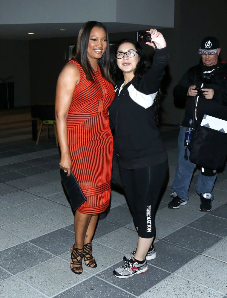 Garcelle Beavais snaps a selfie with a fan