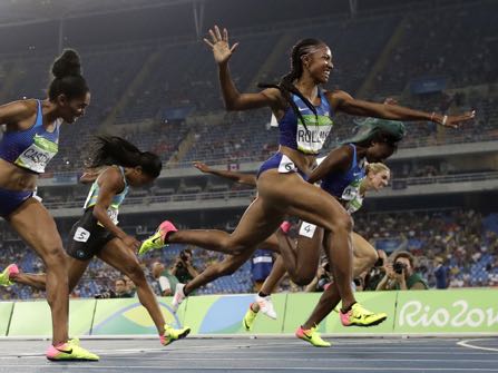 Brianna Rollins from the United States celebrates after winning the gold medal in the women's 100-meter hurdles final during the athletics competitions of the 2016 Summer Olympics at the Olympic stadium in Rio de Janeiro, Brazil, Wednesday, Aug. 17, 2016. (AP Photo/Matt Dunham)