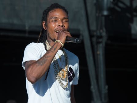 FILE - In this Aug. 20, 2016 file photo, recording artist Fetty Wap performs at the 2016 Billboard Hot 100 Music Festival in Wantagh, N.Y. An investigation into how rapper Fetty Wap was allowed to record a music video that included drug references and a pole dancer in his old New Jersey high school has concluded that the school's principal was solely responsible. (Photo by Scott Roth/Invision/AP, File)