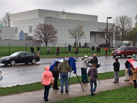 FILE - In this April 21, 2016 file photo, people stand outside the entertainer Prince's Paisley Park compound in Chanhassen, Minn. Paisley Park, the private estate and production complex of the late rock superstar Prince, will open for public tours starting Oct. 6. (Jim Gehrz/Star Tribune via AP, File)