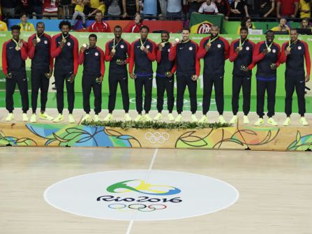 The United States' team poses with their gold medals for men's basketball at the 2016 Summer Olympics in Rio de Janeiro, Brazil, Sunday, Aug. 21, 2016. (AP Photo/Charlie Neibergall)