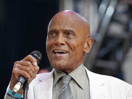 FILE - In this July 20, 2014 file photo, singer and activist Harry Belafonte speaks during a memorial tribute concert for folk icon and civil rights activist Pete Seeger at Lincoln Center's Damrosch Park in New York. The Academy of Motion Picture Arts and Sciences will present Honorary Awards to Jean-Claude Carrière, Hayao Miyazaki and Maureen O’Hara, and the Jean Hersholt Humanitarian Award to Belafonte.  All four awards will be presented at the Academy’s 6th Annual Governors Awards on Saturday, November 8, 2014, at the Ray Dolby Ballroom at Hollywood & Highland Center in Los Angeles. (AP Photo/Kathy Willens, File)