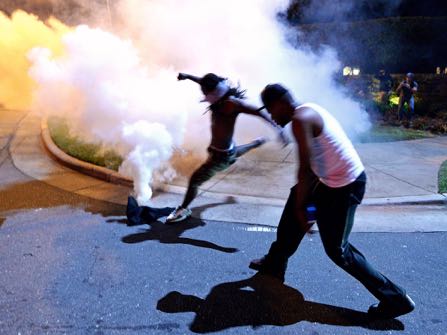 Protesters demonstrate in Charlotte, N.C., Tuesday, Sept. 20, 2016. Authorities used tear gas to disperse protesters in an overnight demonstration that broke out Tuesday after Keith Lamont Scott was fatally shot by an officer at an apartment complex. (Jeff Siner/The Charlotte Observer via AP)