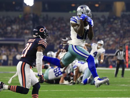 FILE - In this Sept. 25, 2016, file photo, Chicago Bears cornerback Tracy Porter (21) defends as Dallas Cowboys wide receiver Dez Bryant (88) catches a pass thrown by Dak Prescott (4) for a touchdown during the second half of an NFL football game in Arlington, Texas. Bryant has a slight hairline fracture in a bone in his right knee, though coach Jason Garrett says the receiver might not miss a game. Bryant didn’t practice Wednesday, three days after getting hurt in a win over Chicago, and the same day the team got back results of an MRI. (AP Photo/Ron Jenkins, File)