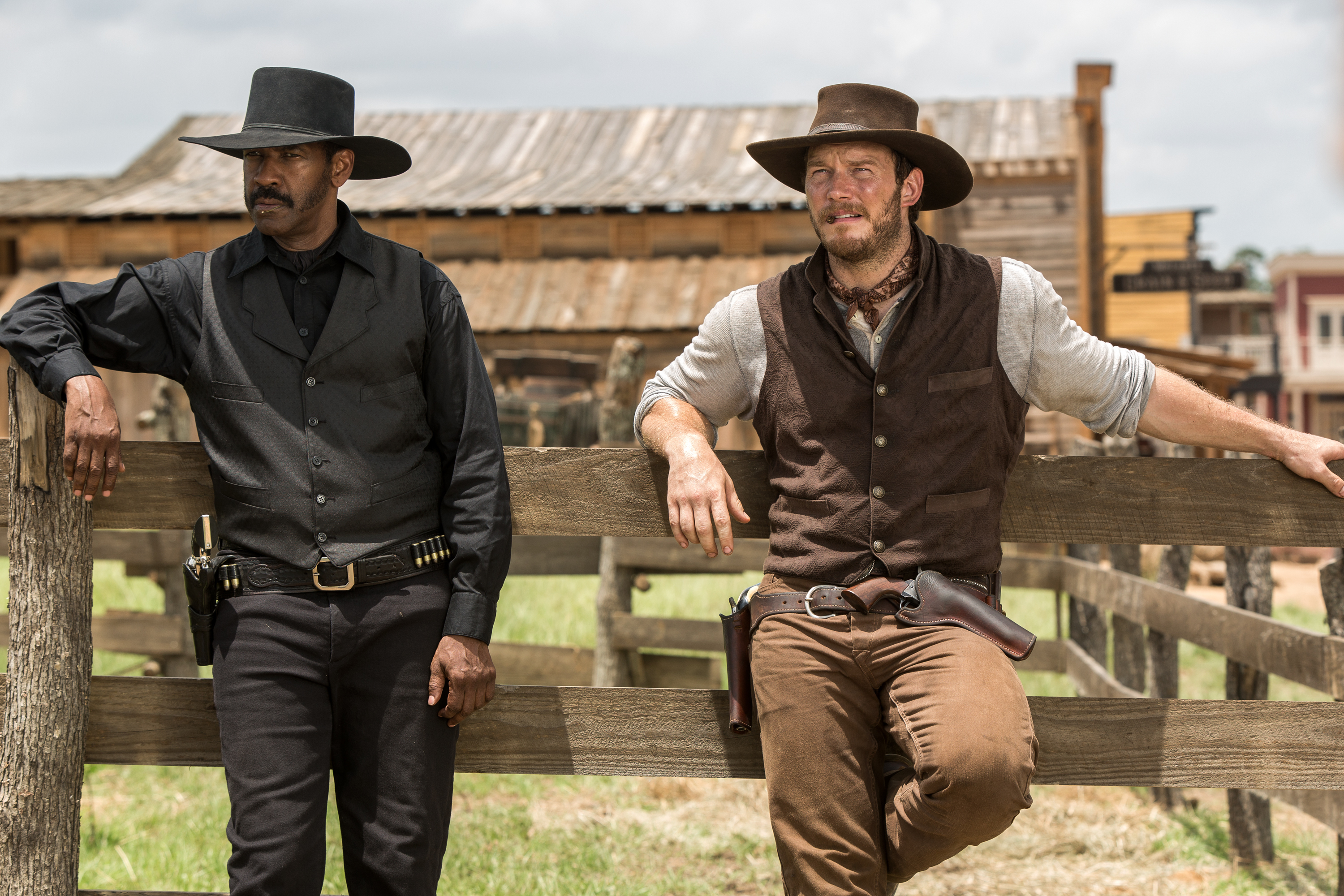 In this image released by Sony Pictures, Chris Pratt, right, and Denzel Washington appear in a scene from "The Magnificent Seven." Antoine Fuqua’s “The Magnificent Seven” remake rode the star power of Denzel Washington to an estimated $35 million debut, topping North American ticket sales over the weekend. (Sam Emerson/Sony Pictures via AP)
