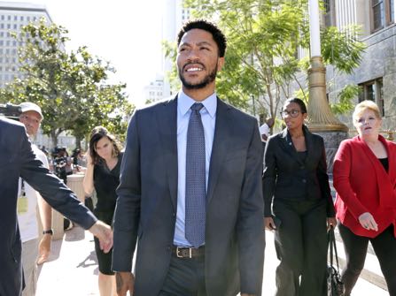 NBA star Derrick Rose smiles as he leaves federal court in Los Angeles Wednesday, Oct. 19, 2016. Jurors cleared Rose and two friends in a lawsuit that accused them of gang raping his ex-girlfriend when she was incapacitated from drugs or alcohol. The jury reached the verdict Wednesday in Los Angeles federal court after hearing dramatically different accounts of the August 2013 sexual encounter. (AP Photo/Nick Ut)