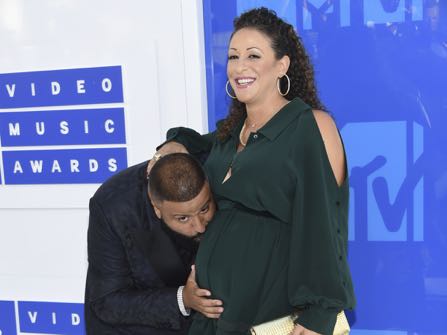 FILE - In this Sunday, Aug. 28, 2016, file photo, DJ Khaled, left, and Nicole Tuck arrive at the MTV Video Music Awards at Madison Square Garden in New York. DJ Khaled and his fiancee Nicole Tuck welcomed their first child, a boy, into the world early Sunday, Oct. 23, 2016. Khaled chronicled the birth in a series of snapchats showing inside the delivery room where he can be heard telling the doctor that “it’s go time.” (Photo by Evan Agostini/Invision/AP, File)