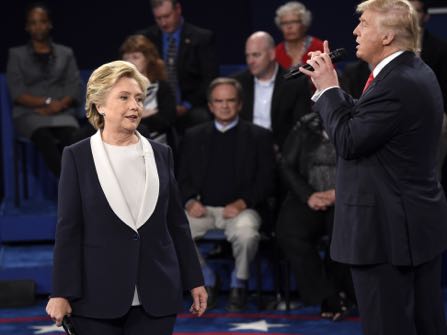 Democratic presidential nominee Hillary Clinton, reacts as Republican presidential nominee Donald Trump during the second presidential debate at Washington University in St. Louis, Sunday, Oct. 9, 2016. (Saul Loeb/Pool via AP)
