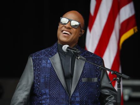 FILE - In this Sept. 24, 2016 file photo, singer Stevie Wonder performs at the dedication ceremony for the Smithsonian Museum of African American History and Culture on the National Mall in Washington. Wonder is one of the featured performers who will pay tribute to Prince at a Minnesota concert Thursday night Oct. 13, 2016. (AP Photo/Pablo Martinez Monsivais, File)