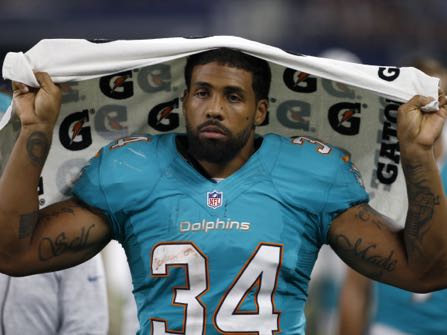 This Aug. 19, 2016 photo shows Miami Dolphins running back Arian Foster (34) walking along the sideline during an NFL preseason football game in Arlington, Texas. Four-time Pro Bowl running back Arian Foster has announced, Monday, Oct. 24, 2016, his retirement midway through an injury-plagued season with the Miami Dolphins. (AP Photo/Michael Ainsworth)
