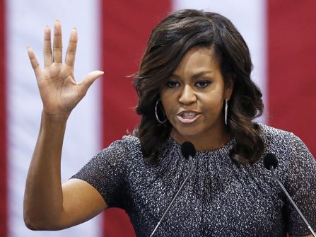 First lady Michelle Obama waves to the crowd after speaking during a campaign rally for Democratic presidential candidate Hillary Clinton Thursday, Oct. 20, 2016, in Phoenix. (AP Photo/Ross D. Franklin)