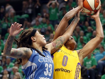 Minnesota Lynx’s Seimone Augustus, left, disrupts a shot attempt by Los Angeles Sparks’ Alana Beard in the first quarter during Game 5 of the WNBA basketball finals Thursday, Oct. 20, 2016, in Minneapolis. (AP Photo/Jim Mone)
