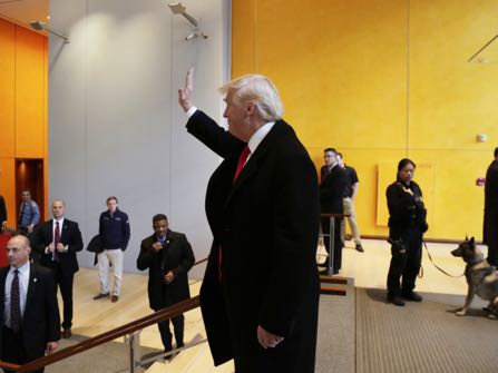President-elect Donald Trump waves to a crowd in the lobby of the New York Times building following a meeting, Tuesday, Nov. 22, 2016, in New York. (AP Photo/Mark Lennihan)