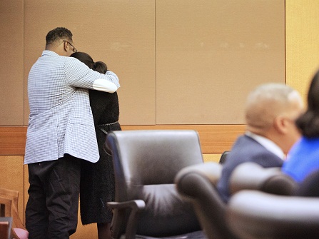 LaPrincia Brown, right, the half-sister of Bobbi Kristina Brown, is comforted by their father Bobby Brown, after taking the witness stand in a wrongful death case against Bobbi Kristina's partner, Nick Gordon, in Atlanta, Thursday, Nov. 17, 2016. Bobbi Kristina Brown was found face-down and unresponsive in a bathtub in her suburban Atlanta townhome in January 2015. (AP Photo/David Goldman, Pool)