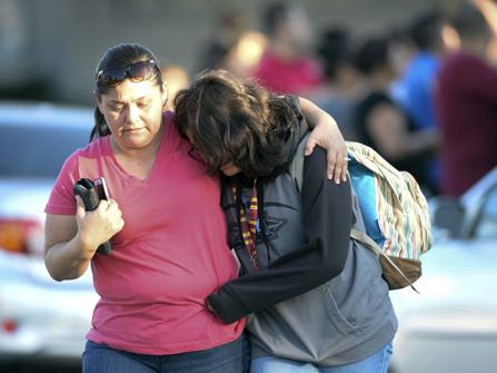 A parent picks up her daughter at Slauson Middle School that was on lochdown as Azusa police and other agencies respond to a shooting near Fourth Street and Orange Avenue in Azusa Calif. on Tuesday November 8, 2016. (Photo by Keith Durflinger/San Gabriel Valley Tribune/SCNG)