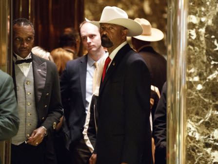 Milwaukee Sheriff David Clarke gets on an elevator after arriving at Trump Tower, Monday, Nov. 28, 2016, in New York. (AP Photo/ Evan Vucci)