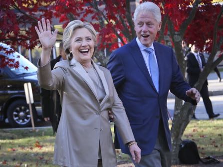 Democratic presidential candidate Hillary Clinton, and her husband former President Bill Clinton, greet supporters after voting in Chappaqua, N.Y., Tuesday, Nov. 8, 2016. (AP Photo/Seth Wenig)