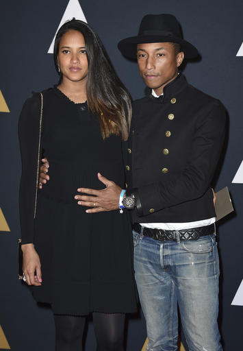 Pharrell Willams and Helen Lasichanh arrive at the 2016 Governors Awards on Saturday, Nov. 12, 2016, in Los Angeles. (Photo by Jordan Strauss/Invision/AP)