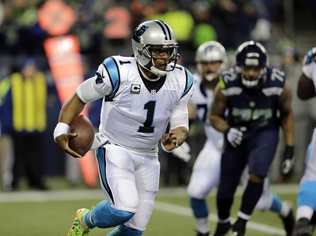 Carolina Panthers quarterback Cam Newton runs with the ball against the Seattle Seahawks in the first half of an NFL football game, Sunday, Dec. 4, 2016, in Seattle. (AP Photo/Stephen Brashear)
