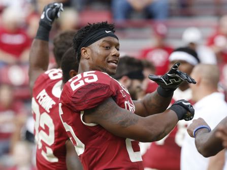 FILE - In this Oct. 15, 2016 file photo, Oklahoma running back Joe Mixon (25) stretches before an NCAA college football game between Kansas State and Oklahoma in Norman, Okla. A video showing Oklahoma running back Mixon punching a female student was released to The Associated Press on Friday, Dec. 16, 2016. The Oklahoma Supreme Court ordered the release last week of a video that the Oklahoma Association of Broadcasters sued to obtain. (AP Photo/Sue Ogrocki, File)