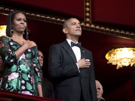 President Barack Obama and first lady Michelle Obama, put their hand over their heart as the national anthem is sang during the Kennedy Center Honors Gala at the Kennedy Center in Washington, Sunday, Dec. 4, 2016. (AP Photo/Manuel Balce Ceneta)