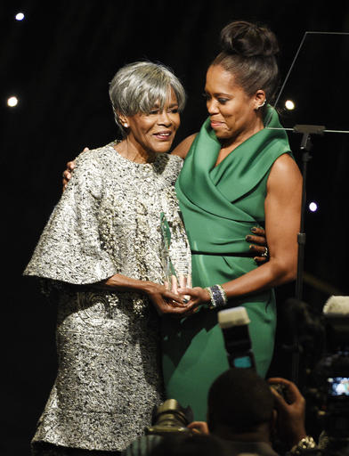 Honoree Cicely Tyson, left, accepts her award from presenter Regina King at the 2016 EBONY Power 100 Gala at the Beverly Hilton on Thursday, Dec. 1, 2016, in Beverly Hills, Calif. (Photo by Chris Pizzello/Invision/AP)