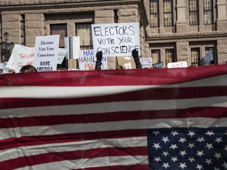 Demonstrators gather outside the Texas State Capitol in an attempt to influence the Republican electors from across the state to not vote for Donald Trump when they cast their formal ballots for president of the United States in Austin, Texas, Monday, Dec. 19, 2016. (AP Photo/Tamir Kalifa)