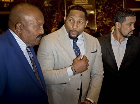 From left, football hall-of-famer Jim Brown, former football player and Ray Lewis and Pastor Darrell Scott talk to reporters in the lobby of Trump Tower in New York, Tuesday, Dec. 13, 2016. (AP Photo/Seth Wenig)