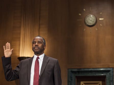 Secretary of Housing and Urban Development-designate Ben Carson is sworn in at the start of a Senate Banking, Housing, and Urban Affairs Committee hearing to confirm his nomination on Capitol Hill in Washington, Thursday, Jan. 12, 2017. (AP Photo/Zach Gibson)