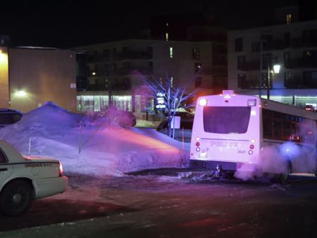 Police survey the scene of a shooting at a Quebec City mosque on Sunday January 29, 2017. THE CANADIAN PRESS/Francis Vachon