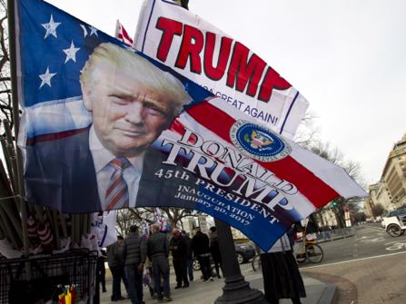 Flags with the image of President-elect Donald Trump are displayed for sale on Pennsylvania Avenue in Washington, Thursday, Jan. 19, 2017, ahead of Friday's inauguration. ( AP Photo/Jose Luis Magana)
