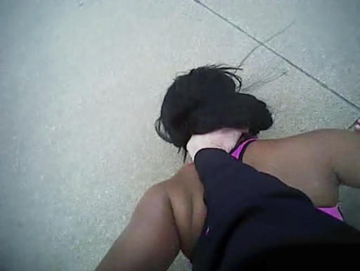 In this Dec. 21, 2016, image from Fort Worth police officer William Martin’s bodycam, Martin holds Jacqueline Craig's daughter down in Fort Worth, Texas. The Fort Worth Police Department denied media requests to release Martin's bodycam footage, however Craig’s attorneys provided the video to The Associated Press on Thursday, Jan. 26, 2017. (Attorneys for Jacqueline Craig/Fort Worth Police Department via AP)
