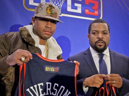 Former NBA player Allen Iverson, left, shows his jersey as he poses with entertainment legend Ice Cube, right, after they announced the launch of the "BIG3, a 3-on-3 half-court professional basketball league for retired players, Wednesday Jan. 11, 2017, in New York. "We are bringing together some of the baddest names to ever play the game," said league co-founder Ice Cube. "I personally can't wait to see my favorite player back in action." (AP Photo/Bebeto Matthews)