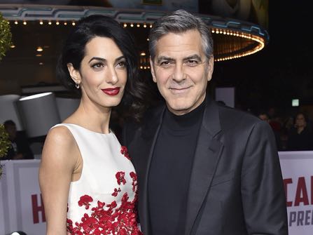 FILE - In this Feb. 1, 2016 file photo, Amal Clooney, left, and George Clooney arrive at the world premiere of "Hail, Caesar!" in Los Angeles. The couple wed on Sept. 27, 2014, in Venice, Italy. The Clooneys are expecting twins in June, Julie Chen said Thursday on CBS' "The Talk." George Clooney told Chen in late January that his wife, a human rights attorney, was pregnant, "The Talk" host said. (Photo by Jordan Strauss/Invision/AP, File)