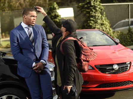 HOLD FOR STORY -- NFL player Cam Newton gets primped before getting his picture taken during the filming of a Buick commercial for this year's Super Bowl telecast, on Friday, Jan. 13, 2017, in Los Angeles. (Photo by Chris Pizzello/Invision/AP)